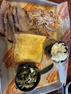 Pick 2 combo dinner, pulled pork and brisket with a side of Mac and cheese and collard greens.