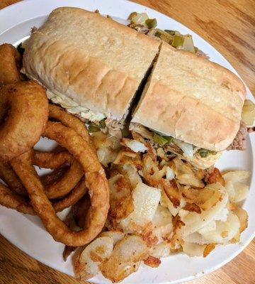 Smokehouse special. (This is a Philly Cheese steak with pulled pork or chicken). Onion rings and fried potatoes aka taters.