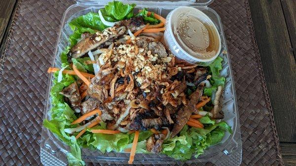 Take away grilled chicken salad. Dressing seemed to be a non-fatty liquid - so low calorie?. Good.