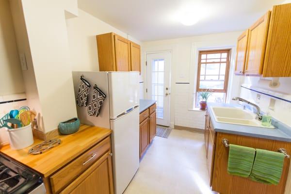 Fully equipped kitchen with service for 8; full size range, refrigerator, dishwasher, microwave. Then step out the door and dine in garden.