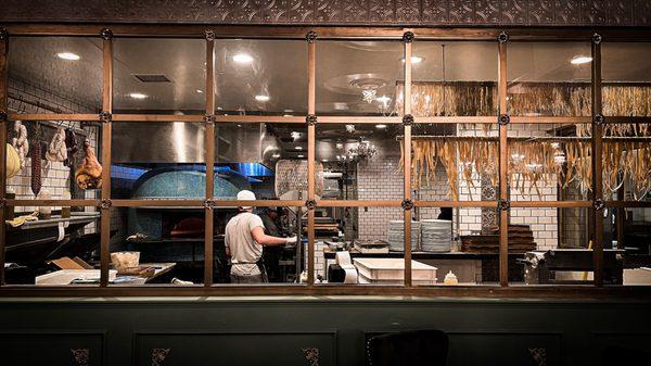 Pizza oven, fresh pasta drying in the corner