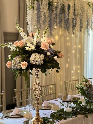 Elegant risers with lighted backdrop with blue and white wisteria @landollsmohicancastle