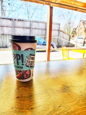 Coffee at the bar overlooking the sidewalk patio outside