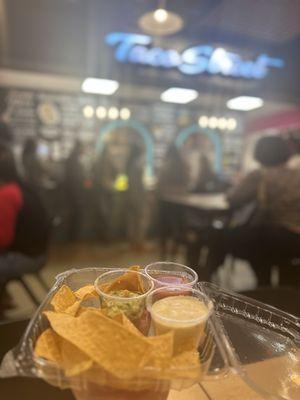 Chips queso salsa and guac sampler