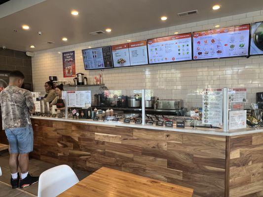 The food line at the counter and the menus behind.