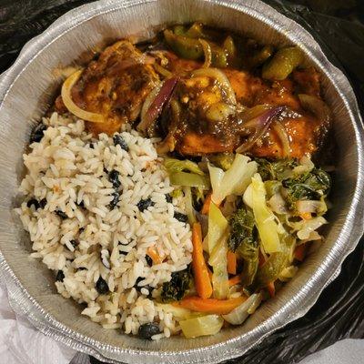 Salmon platter with brown rice and sautéed veggies and jerk sauce