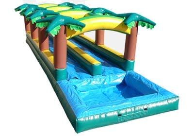 SLIP N SLIDE  You'll be in paradise with this tropical 37-foot slip in slide. Hop on and race a friend to the pool at the end!