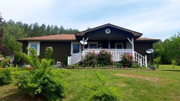 Customer needed a roof,vinyl siding, gutters and Railing for porch.