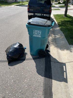 My trash can and the bag they took out of it.