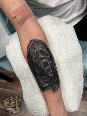 Ghost face tattoo