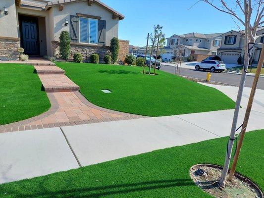 Beautiful front yard pavers  and synthetic grass