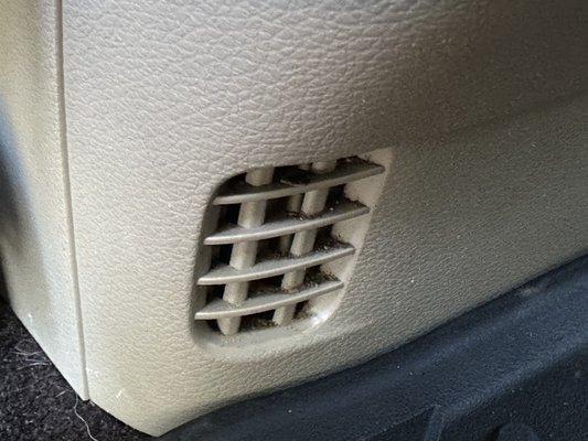 Visible residue/grime in vent AFTER vehicle was detailed