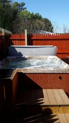 This is the outside hot tub during a nice sunny day. It is totally enclosed for your privacy.