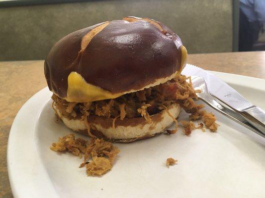 Pulled pork on a pretzel bun