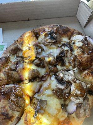 Iron pizza. Sausage with bourbon glazed onions and mushrooms on a garlic sauce. Perfect crust and balance of flavors