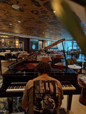 I asked one of the servers to take a photo of me, I love pianos! She did so willingly and has a keen eye for photography