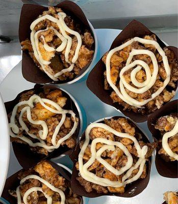 Deconstructed Cinnabons in a paper bowl with a dead Pokémon swirly eyes glaze