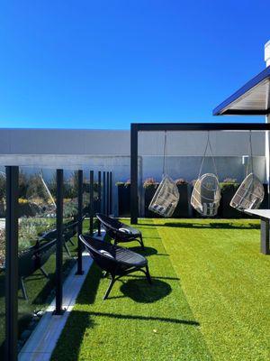 Rooftop Green-space with outdoor seating and relaxation swings!