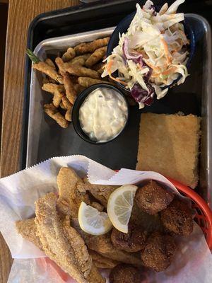 Catfish with hush puppies, fries and coleslaw.