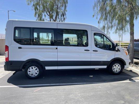 UCS Limo of San Bruno's Ford Transit 15 Passenger van midroof from the side