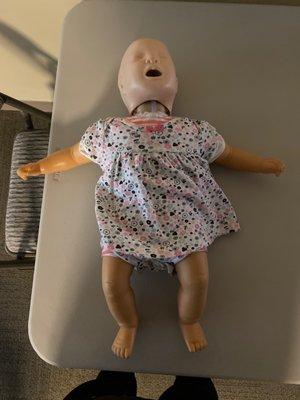 Infant size dummy (year one and under)to practice with.