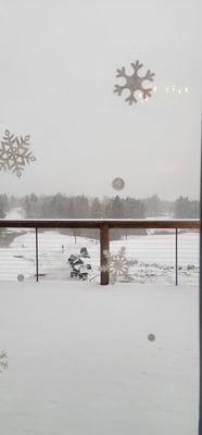 View from the dining room overlooking the deck and golf course.