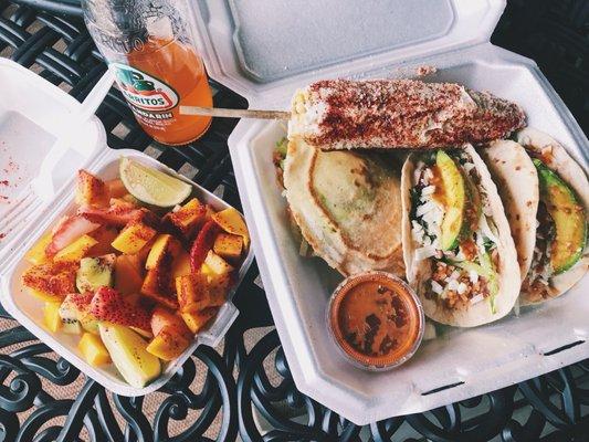 Mandarin soda, sour fruit cup (small), Mexican style corn, vegetarian gordida, and two spicy vegetarian tacos with avocado and cheese!