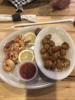 5 shrimp, 2 hush puppies, 2 slices of lemon, about 1/2 cup of fried okra and cocktail sauce.