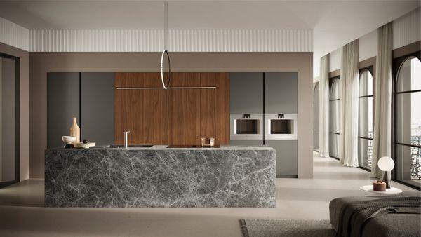 Contemporary Kitchen with natural Stone Island, and Ultra Matte Laminates