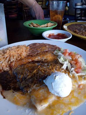 Number three; cheese and sour cream, chicken and mole, and birrio enchiladas, with rice and beans. Wonderful!