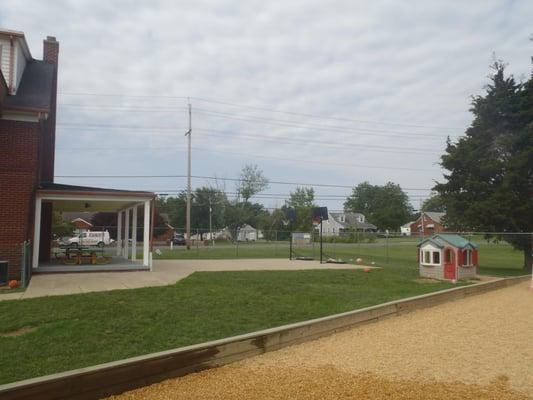 basketball court and patio with picnic tables