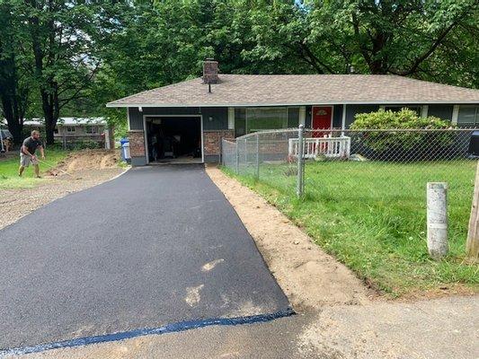 Asphalt driveway on declining slope for water run off