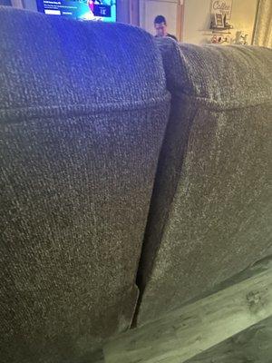 The back is uneven and this side of the couch isn't level with the other side