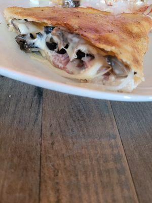 Calzone with shrooms, ricotta onion, ham n olives. Delish!