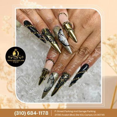 It's time to shine with this bold black and gold nail art, featuring intricate time-inspired designs that add elegance and drama to your