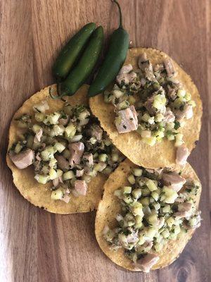 Ahi Tuna Tostadas - ahi tuna, cucumber, cilantro, Serrano, Walla Walla Sweet onion mixed in a original lime marinade.