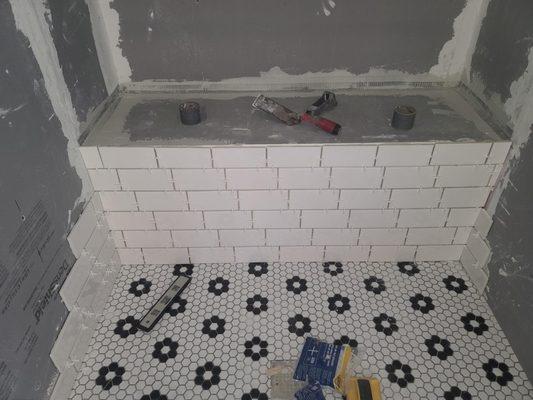 Building a shower from scratch. Subway tile with Penny octagon floor.