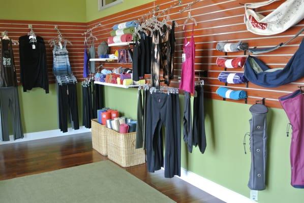 Retail area has all your yoga needs: mats, yogitoes towels, props and clothing.