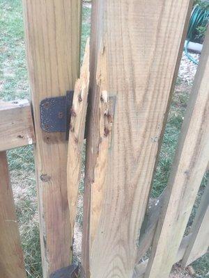 Fence door broken off hinge.