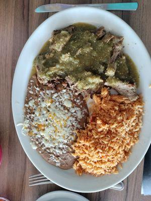 Carnitas lunch special with refried beans and rice.