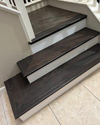 Wooden stair treads and wooden risers.