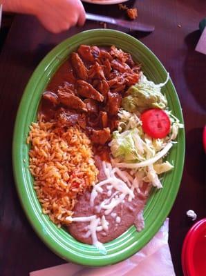 Pork Chili Colorado w/ beans & rice. Spicy. Very good & tender meat. Star of the meal.