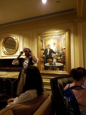 Karima telling the history of the Willard Intercontinental Hotel with Abraham Lincoln