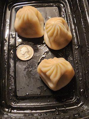 Their pork soup dumplings are truly soooo small and there's barely any soup inside. Quarter photographed for scale.