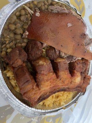 Chicharrón with yellow rice & lentils.