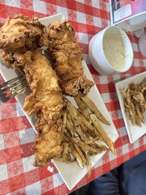 Half a plate of the chicken tenders and homemade fries. It was huge!