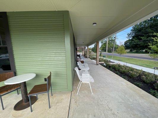 Wrap around porch with seating.