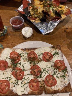 Margherita flatbread and pulled pork nachos.