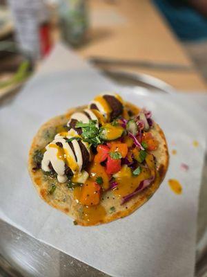 Falafel on an onion pita with salsa. Delicious!