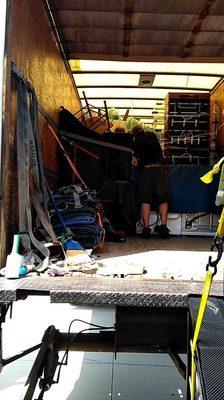 Pat securing belongings in the back of the truck.